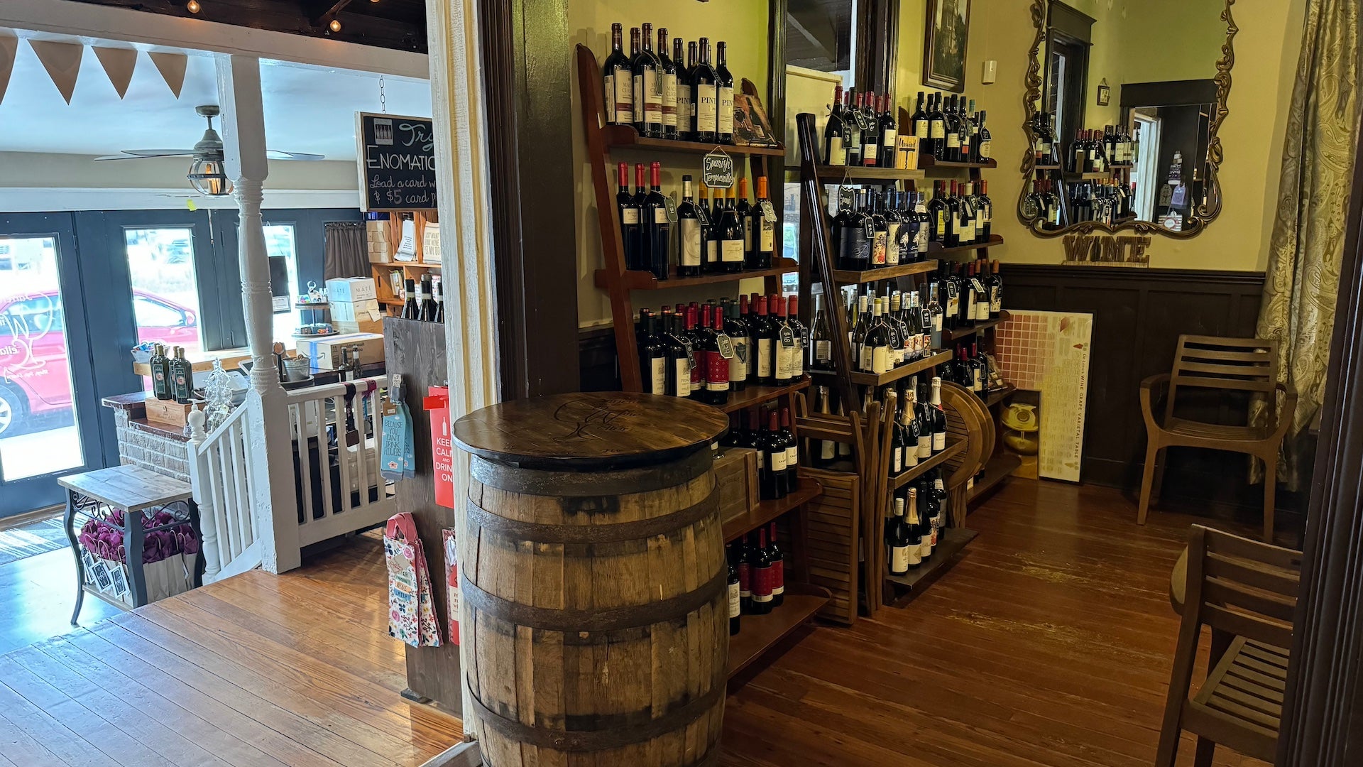 Shelves filled with wine inside a room at a wine bar